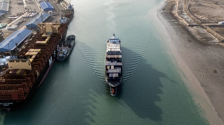 This aerial view shows a container ship cruising at the port of Umm Qasr in Iraq's southern city of Basra. Iraq was among the latest countries to receive a letter from President Donald Trump informing the nation of the rate its goods will be tariffs come August 1 at absent a trade deal.