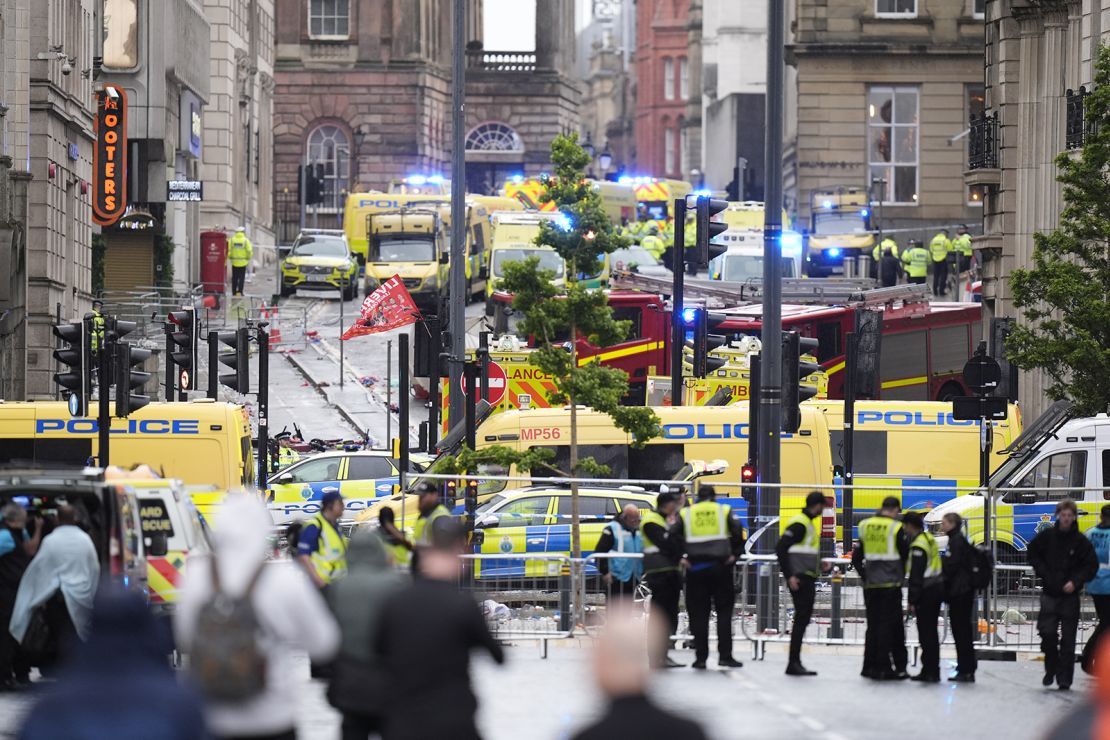 Police and emergency personnel on Water Street near the Liver Building in Liverpool after a car collided with pedestrians during the Premier League winners parade on May 26, 2025.