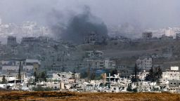 TOPSHOT - This picture taken from a position in southern Israel, on the border with the Gaza Strip, shows smoke billowing above destroyed buildings during Israeli bombardment in the besieged Palestinian territory on May 27, 2025. Israeli Prime Minister Benjamin Netanyahu vowed May 26 to bring back all hostages, "living and dead", as Gaza rescuers said Israeli strikes killed at least 52 people in the war-battered Palestinian enclave. (Photo by Jack GUEZ / AFP) (Photo by JACK GUEZ/AFP via Getty Images)          