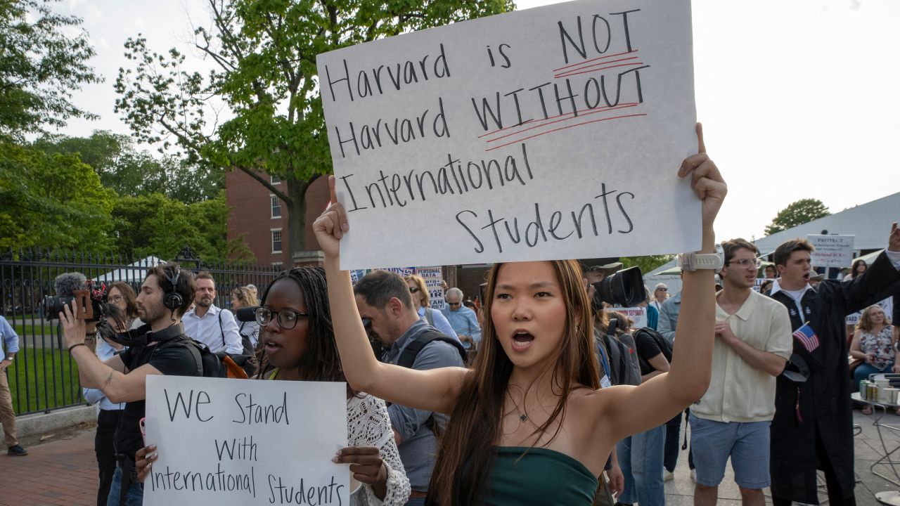 People hold up signs during the Harvard Students for Freedom rally in support of international students at the Harvard University campus in Boston, Massachusetts, on Tuesday.