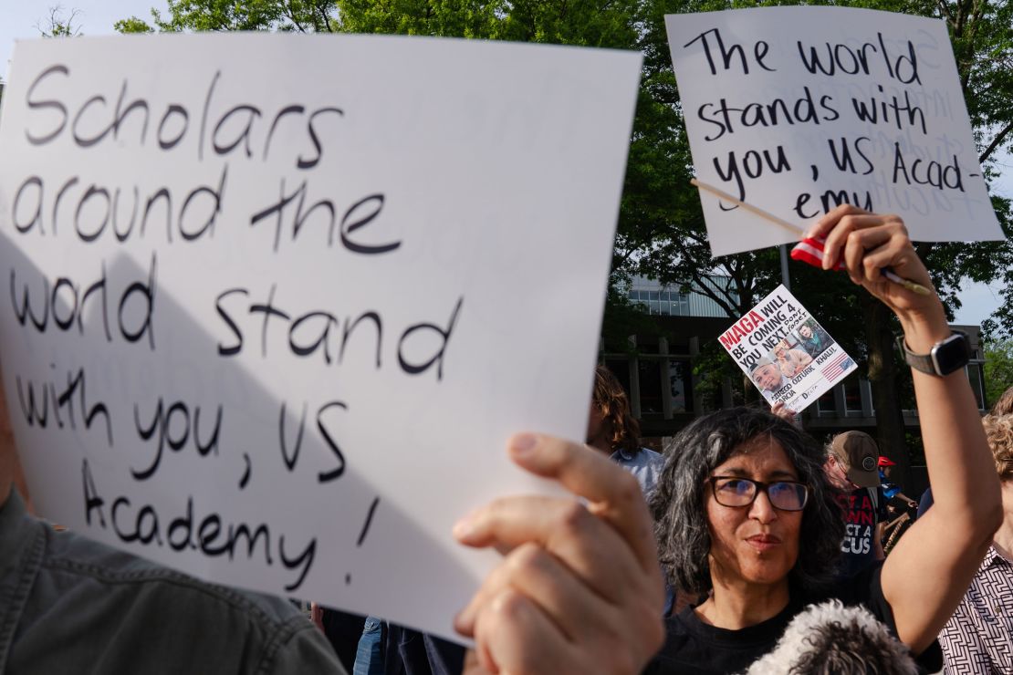 Demonstrators hold signs during a protest in support of international students at Harvard University in Cambridge, Massachusetts, on Tuesday, May 27, 2025.
