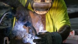 A worker arc welds a metal door during production at the Metal Manufacturing Co. facility in Sacramento on May 27. Corporate America could come out a winner in Trump's domestic policy bill.