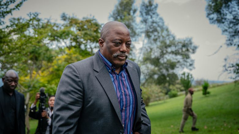 Former President of the Democratic Republic of Congo Joseph Kabila walks back into his house after posing for a group photo with religious leaders at one of his residences in Goma on May 29, 2025.