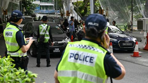 Police keep watch on vehicles entering the venue of the Shangri-La Dialogue Summit in Singapore on May 30, 2025. (Photo by MOHD RASFAN / AFP) (Photo by MOHD RASFAN/AFP via Getty Images)