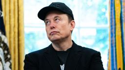 Elon Musk looks on during a news conference with US President Donald Trump in the Oval Office of the White House in Washington, DC, on May 30, 2025. Musk, who stormed into US politics as President Trump's chainsaw-brandishing sidekick, announced on May 28 that he is leaving his role in US government, intended to reduce federal spending, shortly after his first major break with the President over Trump's signature spending bill. (Photo by Allison ROBBERT / AFP) (Photo by ALLISON ROBBERT/AFP via Getty Images)          