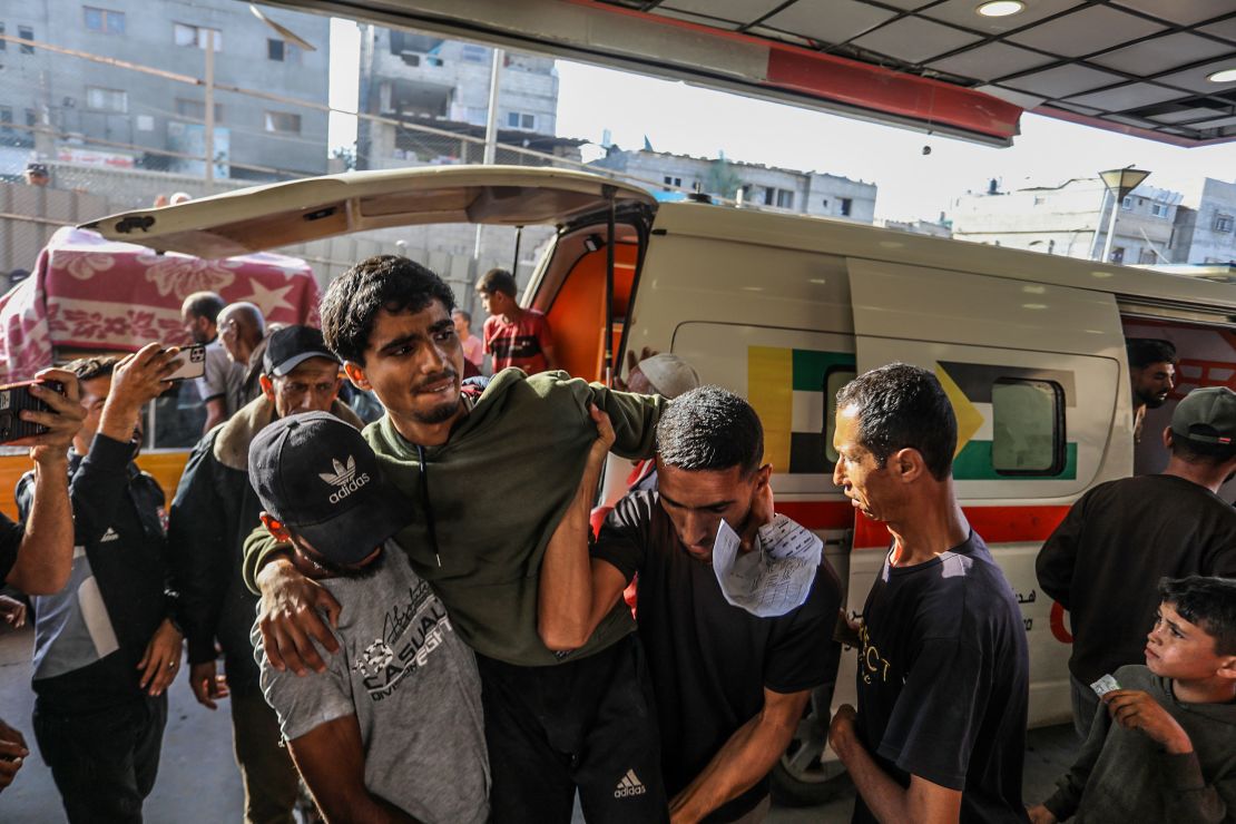 An injured man is brought to Nasser Medical Complex in Khan Younis on Sunday, after Israeli forces reportedly opened fire near an aid distribution center in southern Gaza