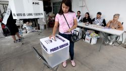 A woman exits the voting booth at a polling station during the world-first Mexican elections for all judges and magistrates in Guadalajara, Jalisco state, Mexico on June 1, 2025. Polls opened Sunday in elections making Mexico the world's only country to select its judges at all levels by popular vote. (Photo by STRINGER / AFP) (Photo by STRINGER/AFP via Getty Images)