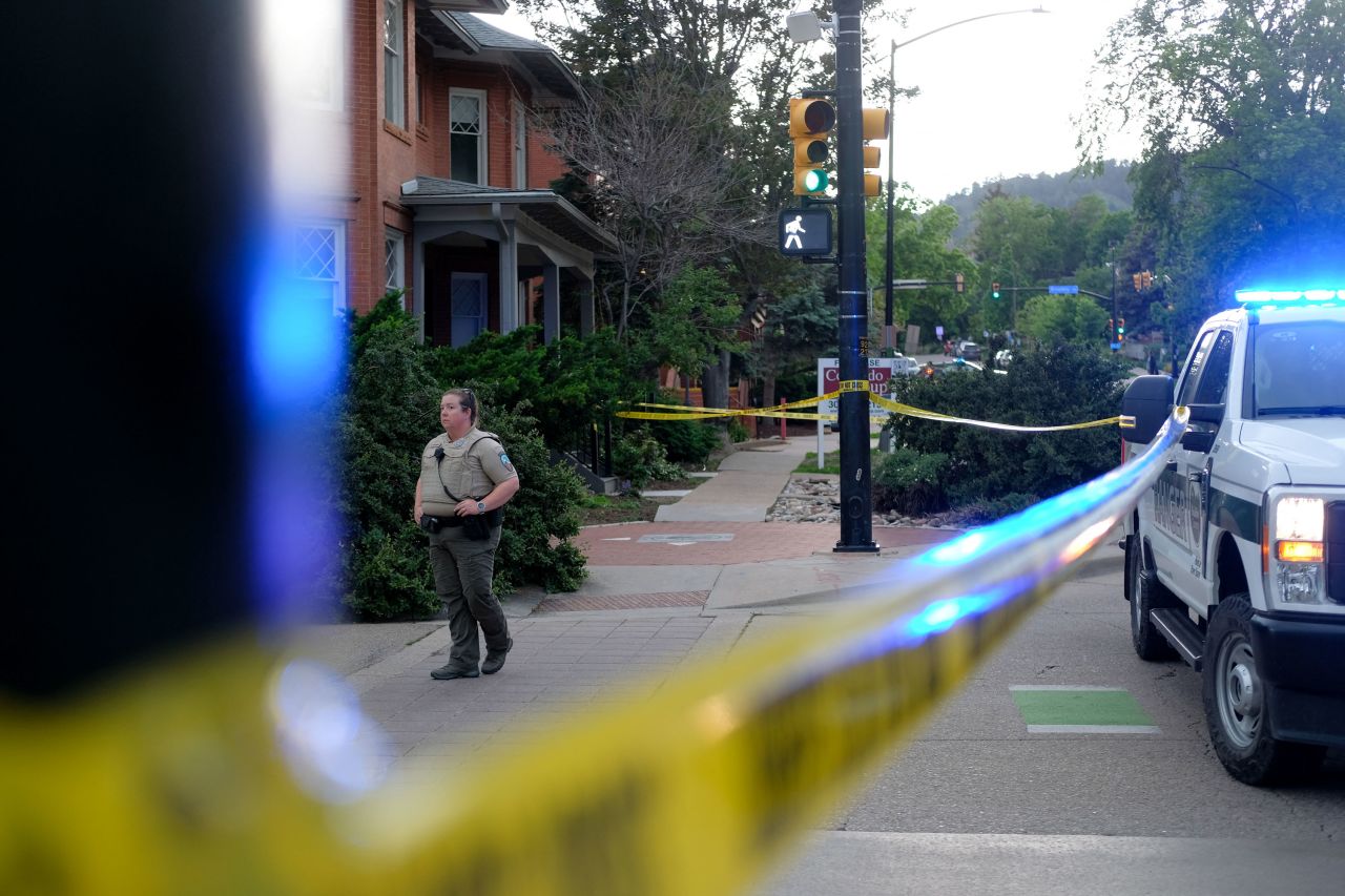 A police officer stands on Pearl street in Boulder, Colorado, on Sunday.