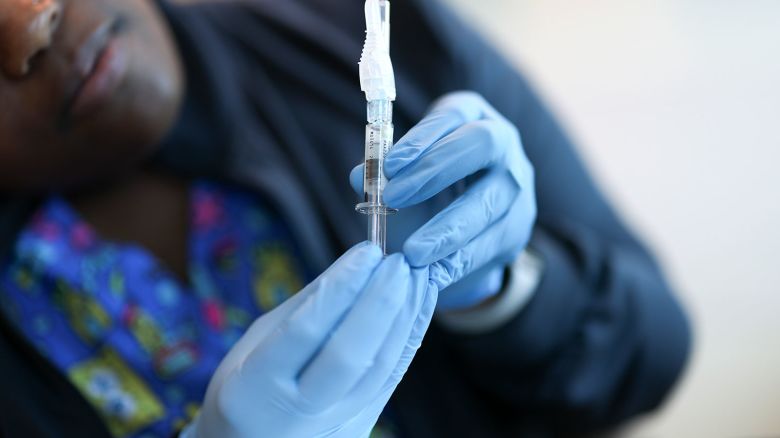 In this photo illustration, Ruth Jones, Immunization Nurse, holds a Pfizer-BioNTech COVID-19 vaccine at Borinquen Health Care Center in Miami, Florida on May 29, 2025.