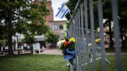 Flowers and a flag at the site of the attack outside the Boulder County Courthouse in Boulder, Colorado, on 2 June, 2025.