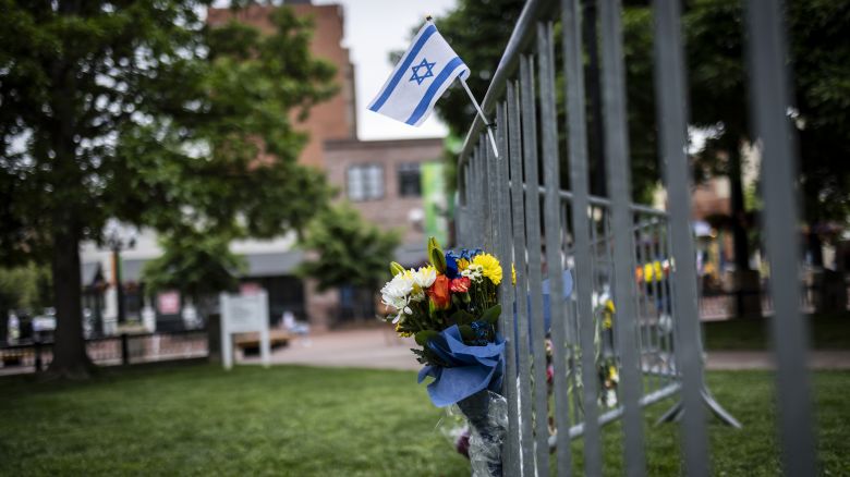 Flowers and a flag at the site of the attack outside the Boulder County Courthouse in Boulder, Colorado, on 2 June, 2025.
