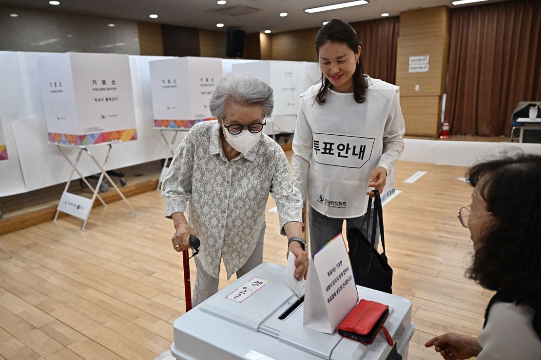 A woman votes at a polling station in Seoul during the presidential election on June 3, 2025.