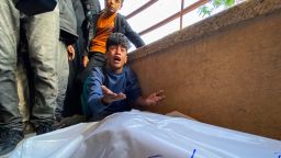 Palestinians mourn by the bodies of relatives who were killed by Israeli fire as they gathered near a US-backed aid center in the Rafah area, at the Nasser hospital in the southern Gaza Strip on June 3, 2025.