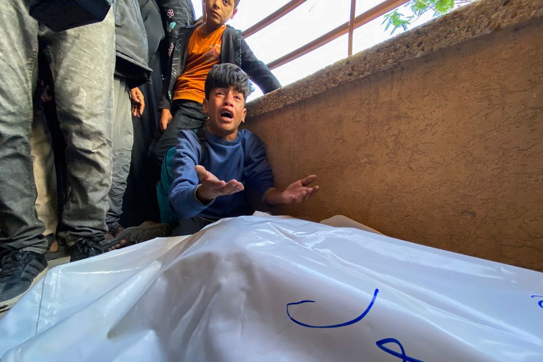 A Palestinian boy mourns loved ones who were killed by Israeli fire, as they gathered to try and access food near a US-backed aid center in Rafah, at Nasser Hospital, in southern Gaza, on June 3.