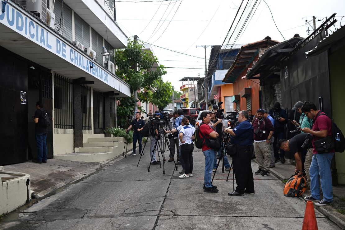 Journalists wait at the entrance to the Chalatenango Judicial Center, where a public hearing is being held against former military officers accused of ordering the murder of four Dutch journalists during El Salvador's civil war (1980-1992) in Chalatenango, El Salvador on June 3, 2025.