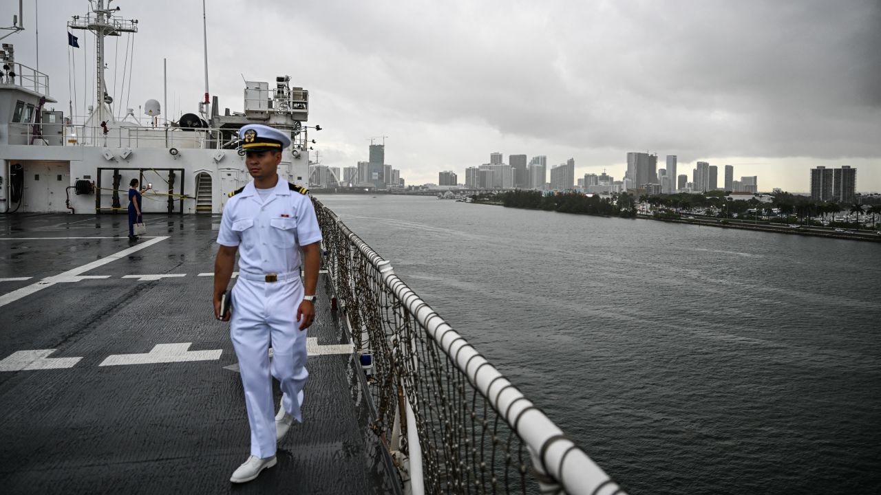 A member of the US Navy walks on the deck of the Navy hospital ship USNS Comfort while docked at the Port of Miami, Biscayne Bay, Miami, Florida on June 3, 2025. The vessel is scheduled to deploy to Latin America and the Caribbean on June 4, embarking on a 10-week humanitarian aid mission. Its itinerary includes planned visits to Colombia, Costa Rica, the Dominican Republic, Grenada, Panama, and Ecuador. (Photo by CHANDAN KHANNA / AFP) (Photo by CHANDAN KHANNA/AFP via Getty Images)          