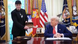 WASHINGTON, DC - MAY 30: Tesla CEO Elon Musk holds a key gifted by U.S. President Donald Trump in the Oval Office of the White House on May 30, 2025 in Washington, DC. Musk, who served as an adviser to Trump and led the Department of Government Efficiency, announced he would leave his role in the Trump istration to refocus on his businesses.  (Photo by Kevin Dietsch/Getty Images)