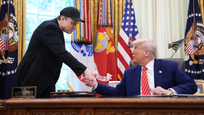 WASHINGTON, DC - MAY 30: Tesla CEO Elon Musk shakes hands with U.S. President Donald Trump as they speak to reporters in the Oval Office of the White House on May 30, 2025 in Washington, DC. Musk, who served as an adviser to Trump and led the Department of Government Efficiency, announced he would leave his role in the Trump istration to refocus on his businesses.  (Photo by Kevin Dietsch/Getty Images)