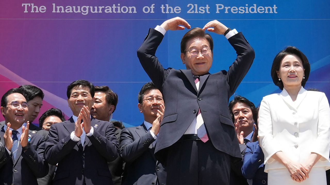South Korea's President Lee Jae-myung makes an arm heart gesture following his inauguration ceremony in Seoul on June 4, 2025.