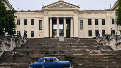 An old American car drives in front of the University of Havana in Havana on June 4, 2025. The new mobile Internet rates in Cuba, which came into effect on May 30 and partially dollarized the service, have unleashed a wave of discontent among s. (Photo by YAMIL LAGE / AFP) (Photo by YAMIL LAGE/AFP via Getty Images)          