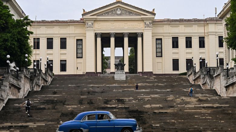 An old American car drives in front of the University of Havana in Havana on June 4, 2025. The new mobile Internet rates in Cuba, which came into effect on May 30 and partially dollarized the service, have unleashed a wave of discontent among s. (Photo by YAMIL LAGE / AFP) (Photo by YAMIL LAGE/AFP via Getty Images)          