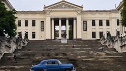 An old American car drives in front of the University of Havana in Havana on June 4, 2025. The new mobile Internet rates in Cuba, which came into effect on May 30 and partially dollarized the service, have unleashed a wave of discontent among s. (Photo by YAMIL LAGE / AFP) (Photo by YAMIL LAGE/AFP via Getty Images)