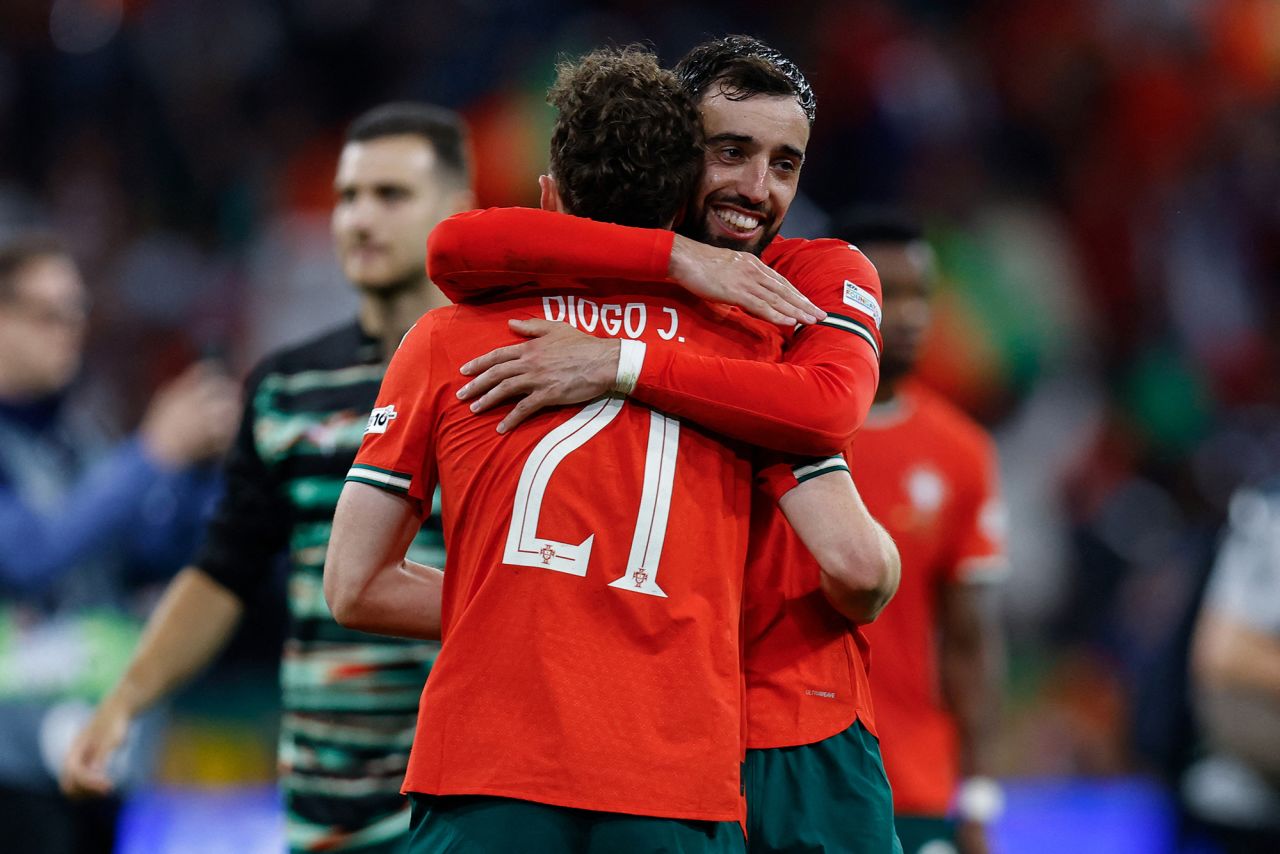 Portugal's midfielder Bruno Fernandes and Portugal's forward Diogo Jota embrace after the UEFA Nations League semi-final football match between Germany and Portugal in Munich, Germany, on June 4.