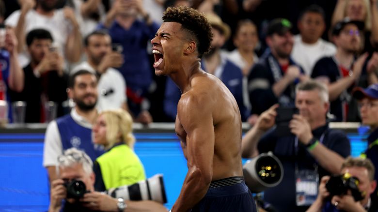 MUNICH, GERMANY - MAY 31: Desire Doue of Paris Saint-Germain celebrates scoring his team's third goal during the UEFA Champions League Final 2025 between Paris Saint-Germain and FC Internazionale Milano at Munich Football Arena on May 31, 2025 in Munich, Germany. (Photo by Lars Baron/Getty Images)
