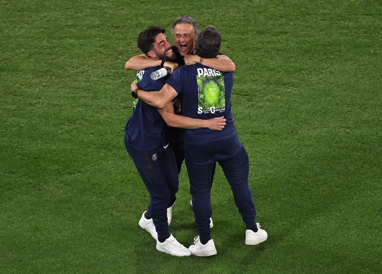 PSG manager Luis Enrique, center, celebrates with members of his coaching staff after the team took a 4-0 lead.