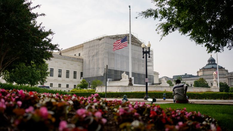 A person rests in front of the US Supreme Court on June 5, 2025 in Washington, DC.