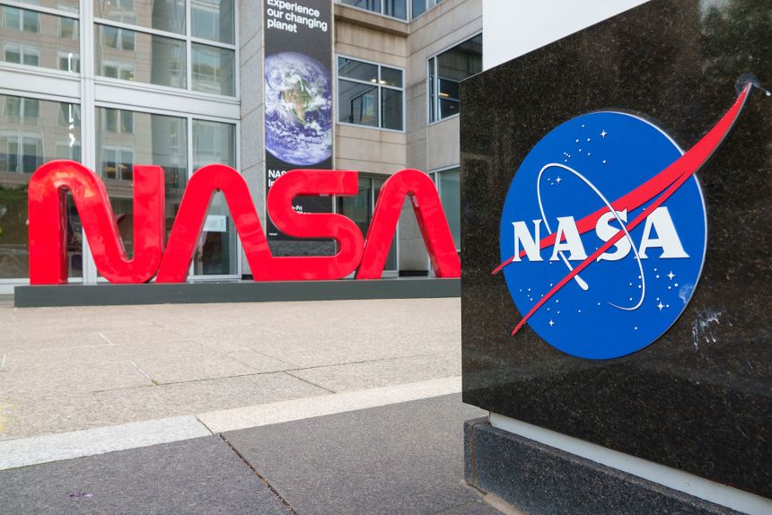 A NASA logo is displayed at the entrance to the Mary W. Jackson NASA Headquarters building on June 2, 2025 in Washington, DC.
