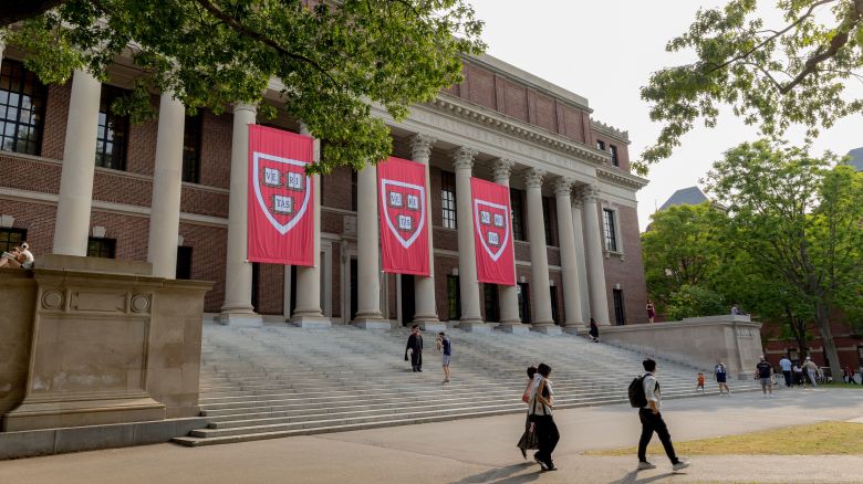 People walk past the Widener Library on the Harvard Campus in Cambridge, Massachusetts, on June 4.