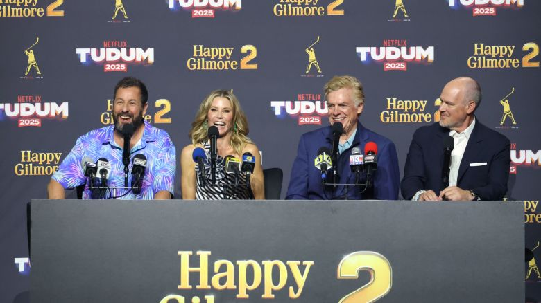 INGLEWOOD, CALIFORNIA - MAY 31: (L-R) Adam Sandler, Julie Bowen, Christopher McDonald, and Rich Eisen speak onstage during NETFLIX TUDUM 2025: THE LIVE EVENT at The Kia Forum on May 31, 2025 in Inglewood, California. (Photo by Amy Sussman/Getty Images for Netflix)