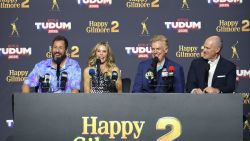 INGLEWOOD, CALIFORNIA - MAY 31: (L-R) Adam Sandler, Julie Bowen, Christopher McDonald, and Rich Eisen speak onstage during NETFLIX TUDUM 2025: THE LIVE EVENT at The Kia Forum on May 31, 2025 in Inglewood, California. (Photo by Amy Sussman/Getty Images for Netflix)