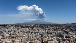 CATANIA, ITALY - JUNE 02: Mount Etna exhibits a Strombolian eruption, with a volcanic plume rising from the southeast crater, on June 02, 2025 in Catania, Italy. An orange aviation warning has been issued. The images show aerial views of the volcano with the city of Catania in the background. (Photo by Fabrizio Villa/Getty Images)