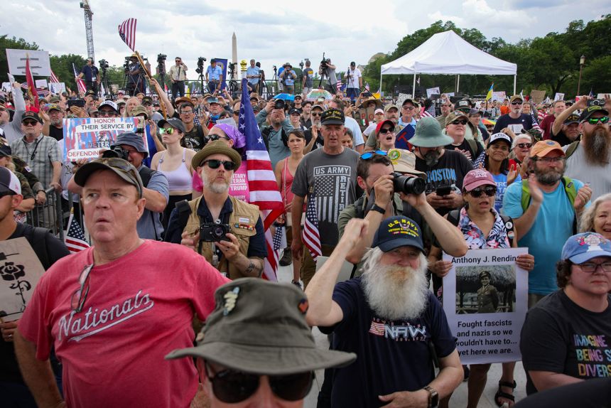 A crowd listens as American punk band Dropkick Murphys performs at the 'Unite for Veterans, Unite for America Rally' on the National Mall in Washington, DC, on June 6, 2025 to support veteran's rights and oppose policies of President Donald Trump.