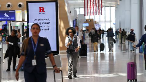 NEWARK, NEW JERSEY - JUNE 02: People move through Newark Liberty International Airport following a news conference by  Transportation Secretary Sean Duffy at the airport, where he announced the reopening of a major runway at the airport, nearly two weeks ahead of schedule on June 02, 2025 in Newark, New Jersey. Delays and cancellations have plagued Newark, one of the nation's busiest airports, for months. Air traffic control outages, runway construction, and an announcement by United Airlines that over 20% of FAA controllers at Newark walked off the job have all contributed to the delays. (Photo by Spencer Platt/Getty Images)