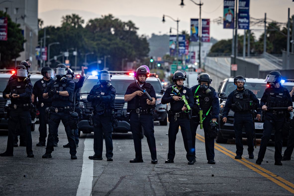 Police clear a street outside the Metropolitan Detention Center as demonstrators gathered in response to immigration raids on Friday, June 6.