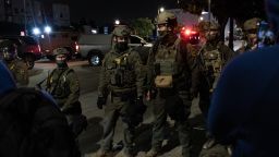Los Angeles, CA - June 06: ICE officers form a barrier to block protesters after performing a raid in Chinatown on Friday, June 6, 2025 in Los Angeles, CA. (Luke Johnson / Los Angeles Times via Getty Images)