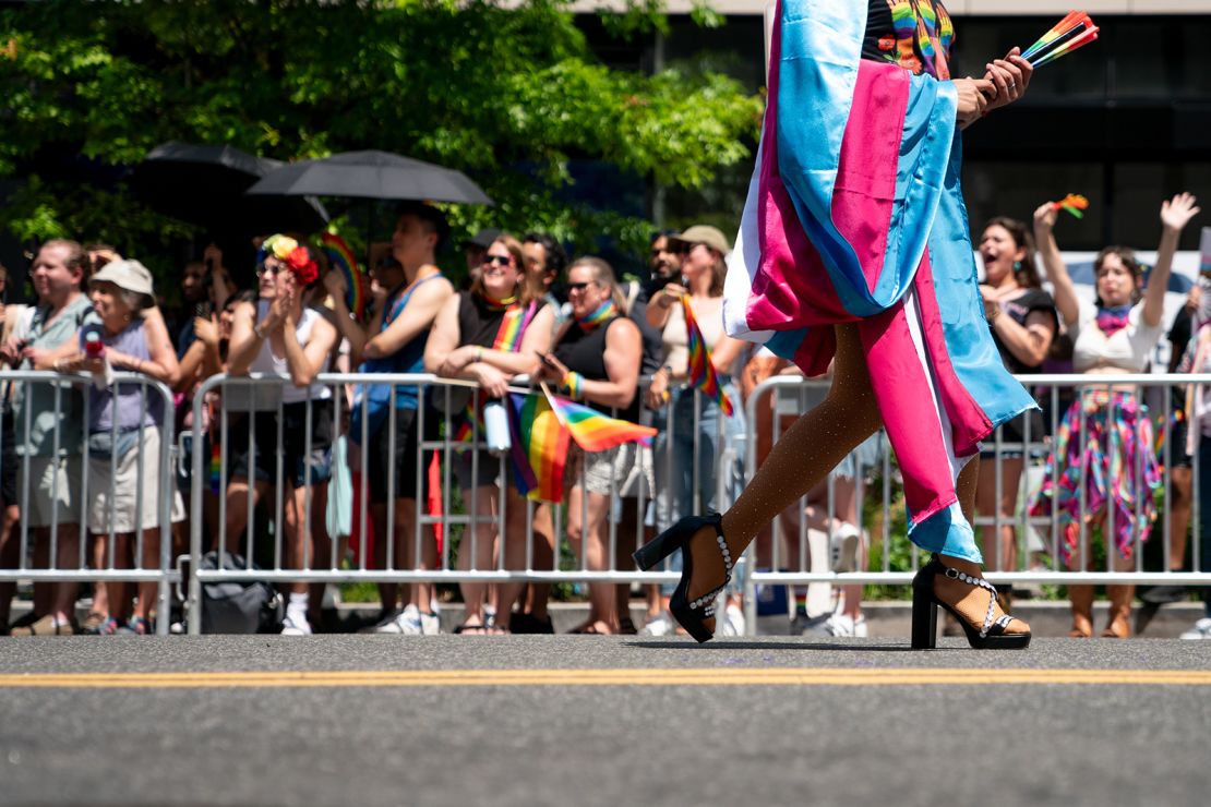An attendee wears a transgender pride flag during the WorldPride 2025 parade in Washington, DC, on Saturday, June 7, 2025.