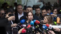 Maria Claudia Tarazona (C), wife of Colombian presidential candidate Miguel Uribe, speaks to the media outside the Fundacion Santa Fe clinic, where her husband is hospitalized after being shot in Bogota on June 8, 2025. A prominent Colombian right-wing presidential candidate who was shot during a campaign event in Bogota has successfully undergone initial surgery, the city's mayor said Sunday. Thirty-nine-year-old Senator Miguel Uribe was speaking to ers in the capital when a gunman shot him twice in the head and once in the knee before being detained. (Photo by Alejandro MARTINEZ / AFP) (Photo by ALEJANDRO MARTINEZ/AFP via Getty Images)          