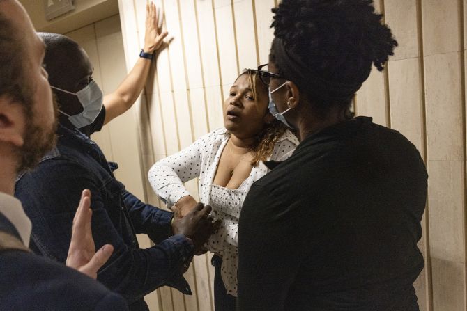 A woman pleads with Immigration and Customs Enforcement officers not to detain her because she has a 15 year old son at home, as she leaves her scheduled court appearance at Federal Plaza in New York on Wednesday, June 4.