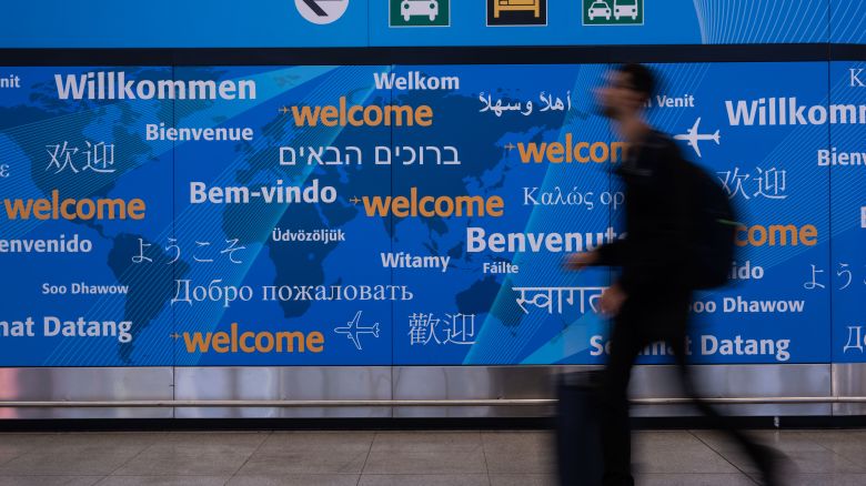 NEW YORK, NEW YORK - JUNE 9: People arrive at John F. Kennedy International Airport on June 9, 2025 in New York City. A new travel ban ordered by U.S. President Donald Trump, restricting entry to citizens from 12 countries, will take effect on Monday. The affected nations include Afghanistan, Myanmar, Chad, the Republic of the Congo, Equatorial Guinea, Eritrea, Haiti, Iran, Libya, Somalia, Sudan, and Yemen.  (Photo by Adam Gray/Getty Images)