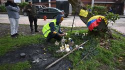 A man light candle in the place after the Senator Miguel Uribe Turbay was shot and wounded in a political event last Saturday in Bogota on June 9, 2025. Doctors treating a Colombian presidential hopeful shot twice in the head by a would-be assassin warned he was not responding well to treatment Monday and that his condition remained grave. (Photo by Raul ARBOLEDA / AFP) (Photo by RAUL ARBOLEDA/AFP via Getty Images)