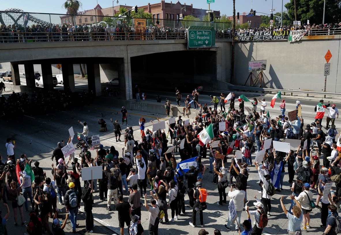 Protesters clash with police on the 101 Freeway in Los Angeles on Tuesday.