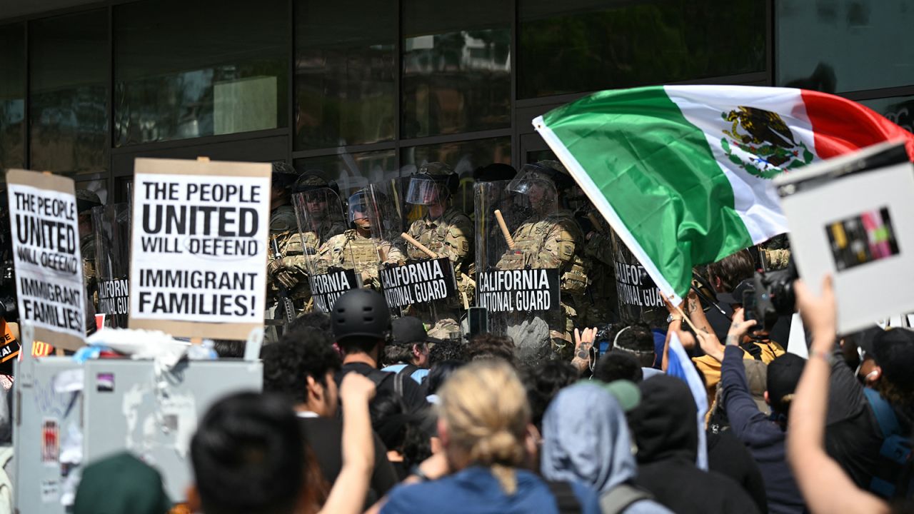 Demonstrators face California National Guard members standing guard outside the Federal Building during a protest in response to federal immigration operations in Los Angeles, on June 9, 2025.