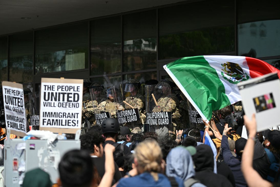 Demonstrators face California National Guard members standing guard outside the Federal Building during a protest in response to federal immigration operations in Los Angeles on June 9.