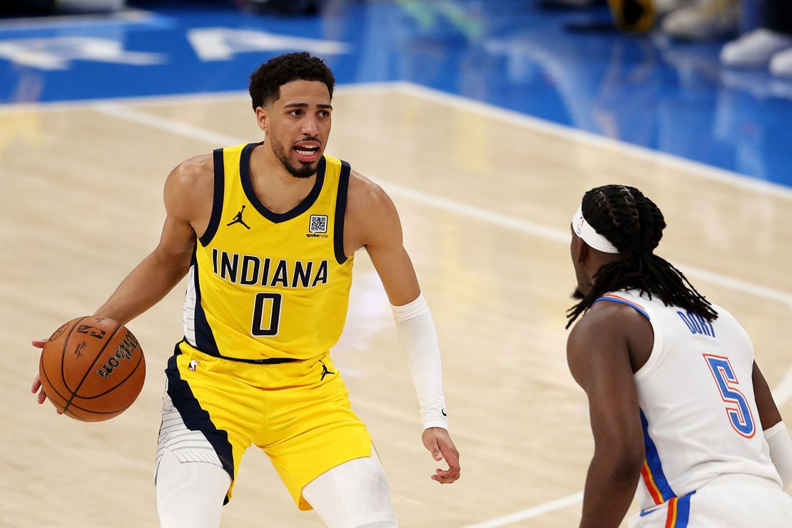 Tyrese Haliburton of the Indiana Pacers is defended by Luguentz Dort #5 of the Oklahoma City Thunder during the second quarter.
