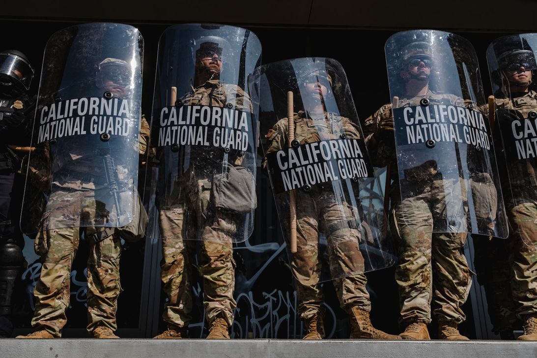 National Guardsmen stand outside of the Edward Roybal Federal Building in Downtown Los Angeles, California, on June 9.