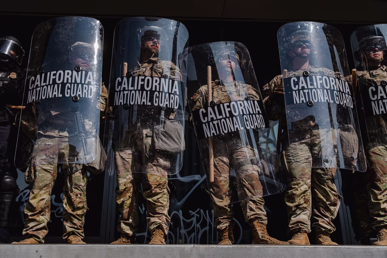 National Guard members stand outside of the Edward Roybal Federal Building in Los Angeles on June 9.